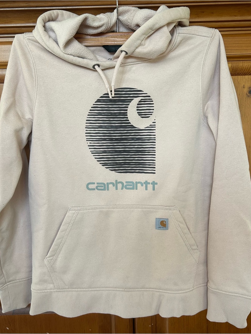 Carhartt Cream Pullover Hoodie with Black Graphic and Teal Logo